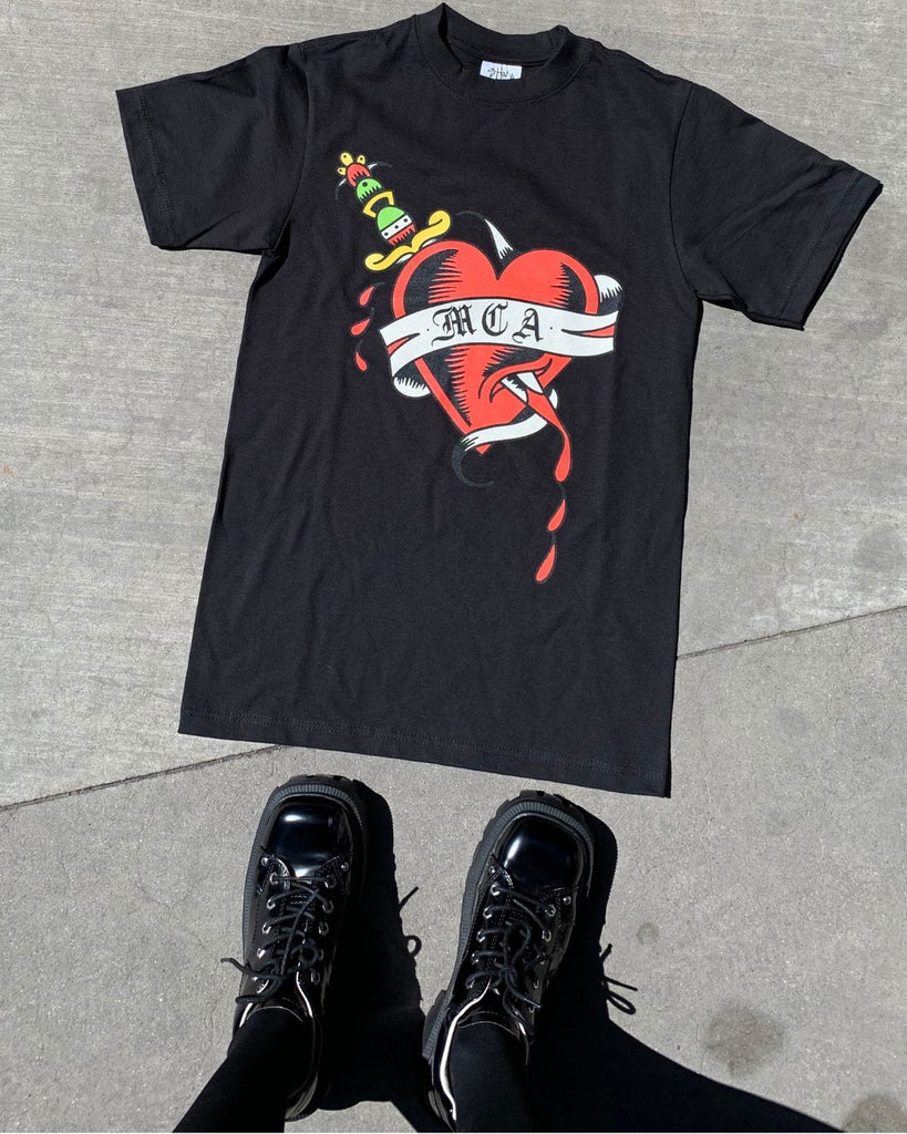 The t-shirt on a cement surface. 